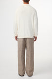Pull Polo L/S Randy Yarn Beige NN.07 vu de dos. Coupe droite et ajustée, offrant une silhouette moderne et élégante. Maille texturée et respirante, idéale pour la mi-saison et l’hiver. À retrouver dans notre boutique à Versailles.